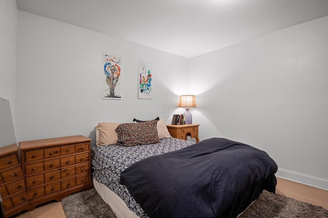 bedroom featuring baseboards