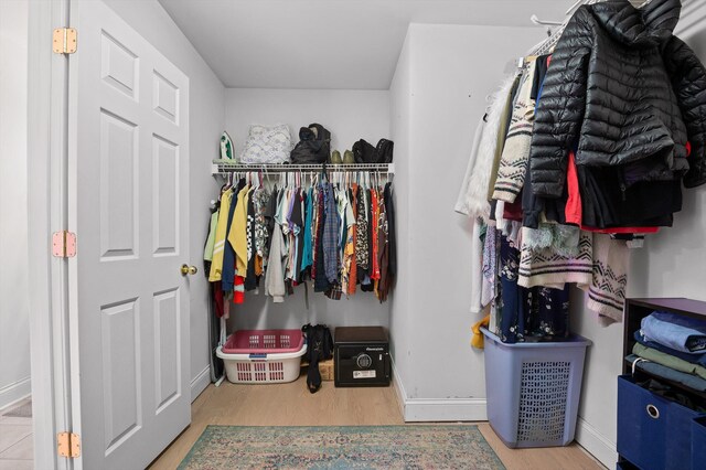 spacious closet with wood finished floors