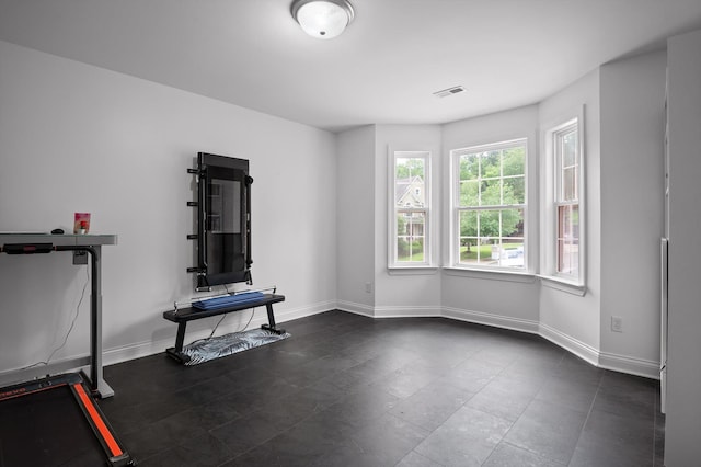 exercise room with baseboards