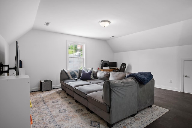 living area with vaulted ceiling, an office area, baseboards, and wood finished floors