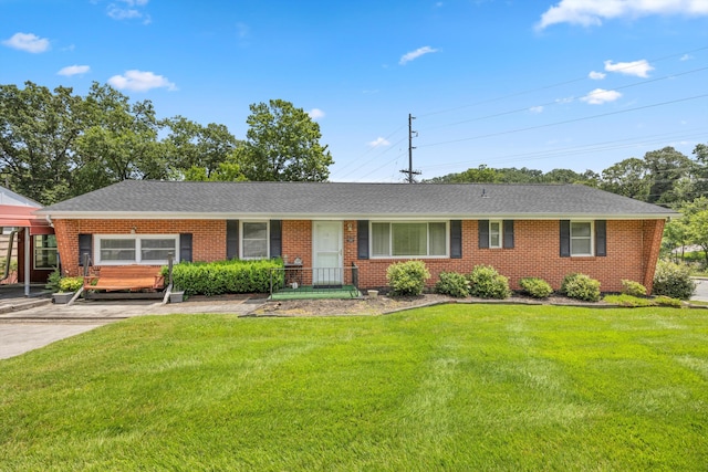 3502 Oak Ridge Dr, Chattanooga, TN 37415 - ranch-style home with brick siding, a front lawn, and a shingled roof