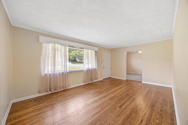 3502 Oak Ridge Dr, Chattanooga, TN 37415 - empty room featuring wood finished floors and a textured ceiling