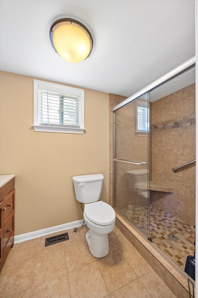 3502 Oak Ridge Dr, Chattanooga, TN 37415 - bathroom featuring vanity, tile patterned floors, and a stall shower
