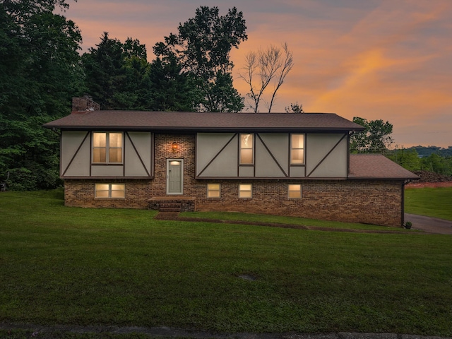 7470 Twin Brook Dr, Chattanooga, TN 37421 - view of front facade featuring brick siding, a yard, and a chimney