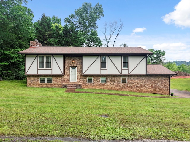 7470 Twin Brook Dr, Chattanooga, TN 37421 - view of front of house with stucco siding, a front lawn, brick siding, and a chimney