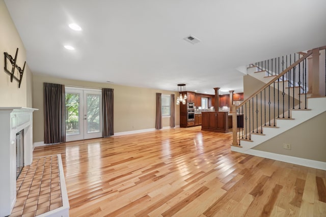 7470 Twin Brook Dr, Chattanooga, TN 37421 - unfurnished living room with light wood-style floors, baseboards, stairs, a fireplace, and recessed lighting