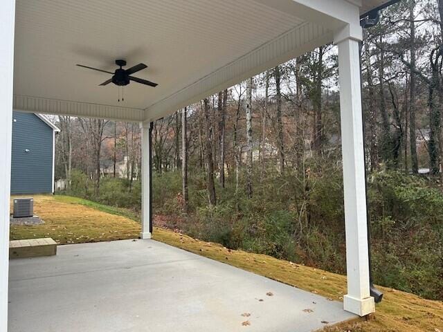 8860 Knolling Loop Unit 37, Ooltewah, TN 37363 - view of patio / terrace with a ceiling fan, central AC unit, and a wooded view