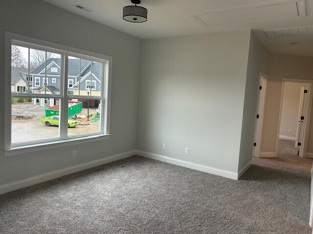 8860 Knolling Loop Unit 37, Ooltewah, TN 37363 - carpeted spare room featuring attic access and baseboards