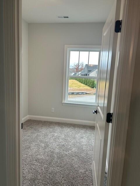 8860 Knolling Loop Unit 37, Ooltewah, TN 37363 - carpeted empty room featuring baseboards