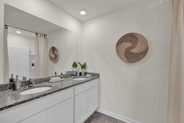 2308 Chelle Dr NE, Cleveland, TN 37323 - bathroom featuring baseboards and double vanity