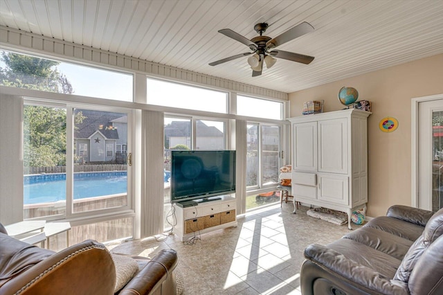 living area with ceiling fan