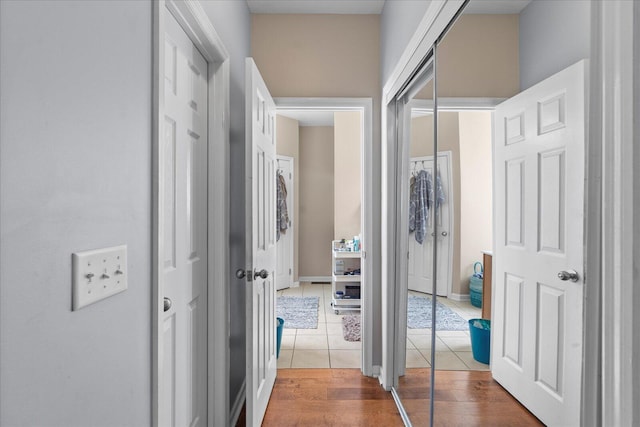 corridor featuring tile patterned flooring