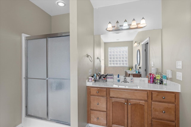 full bathroom featuring a stall shower and vanity