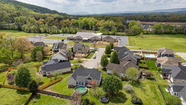 aerial view of residential area featuring a heavily wooded area