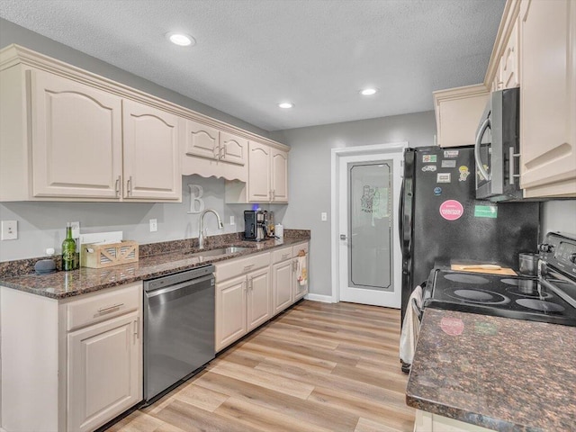 123 Paddle Wheel Ct, Cohutta, GA 30710 - kitchen featuring stainless steel appliances, a sink, light wood-type flooring, recessed lighting, and dark stone countertops