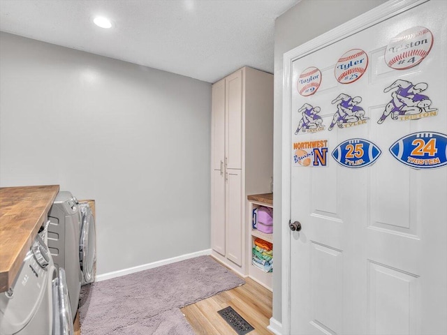 123 Paddle Wheel Ct, Cohutta, GA 30710 - laundry area featuring washing machine and dryer, cabinet space, light wood-style flooring, baseboards, and recessed lighting