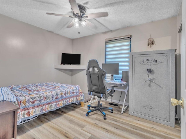 123 Paddle Wheel Ct, Cohutta, GA 30710 - bedroom featuring wood finished floors, a textured ceiling, a desk, and a ceiling fan