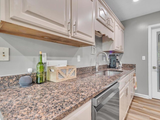 123 Paddle Wheel Ct, Cohutta, GA 30710 - kitchen with dishwashing machine, a sink, light wood finished floors, dark stone countertops, and baseboards