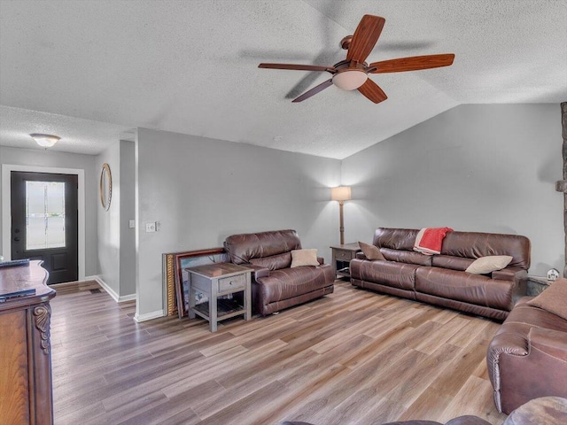 123 Paddle Wheel Ct, Cohutta, GA 30710 - living room with a textured ceiling, a ceiling fan, light wood finished floors, lofted ceiling, and baseboards