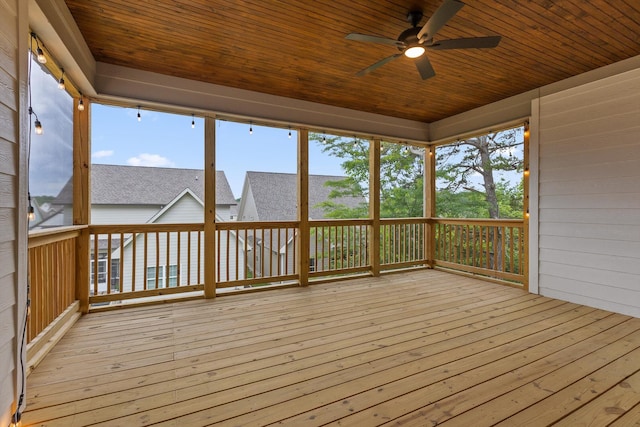 wooden deck featuring a ceiling fan