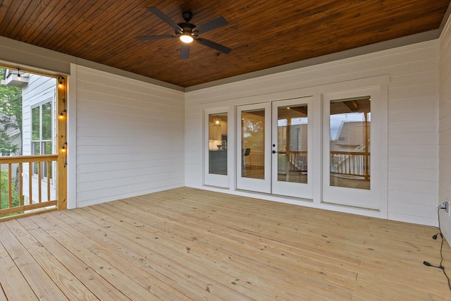 deck with a ceiling fan and french doors