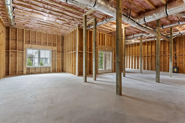 misc room featuring plenty of natural light and concrete flooring