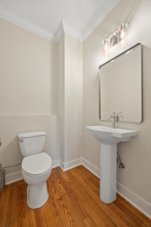 2664 Mowbray Pike Unit 2, Soddy Daisy, TN 37379 - bathroom with crown molding, baseboards, toilet, and wood finished floors