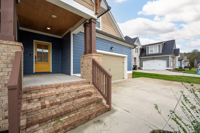 3637 Stickley Way, Apison, TN 37302 - view of exterior entry featuring concrete driveway, a porch, and a garage