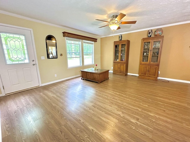 2218 Harvest Ln, Dandridge, TN 37725 - foyer featuring light wood-style floors, ceiling fan, baseboards, and crown molding
