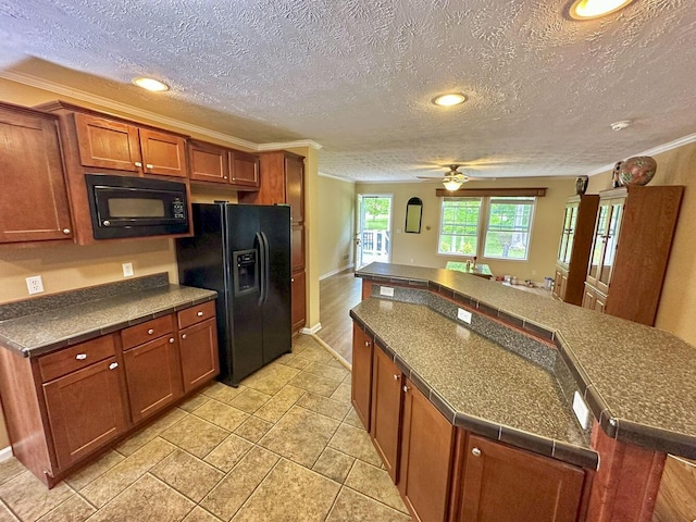2218 Harvest Ln, Dandridge, TN 37725 - kitchen with black appliances, brown cabinets, ornamental molding, ceiling fan, and recessed lighting