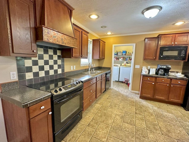 2218 Harvest Ln, Dandridge, TN 37725 - kitchen featuring black appliances, a sink, custom exhaust hood, washing machine and dryer, and ornamental molding
