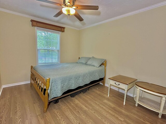 2218 Harvest Ln, Dandridge, TN 37725 - bedroom featuring light wood-type flooring, baseboards, crown molding, and ceiling fan