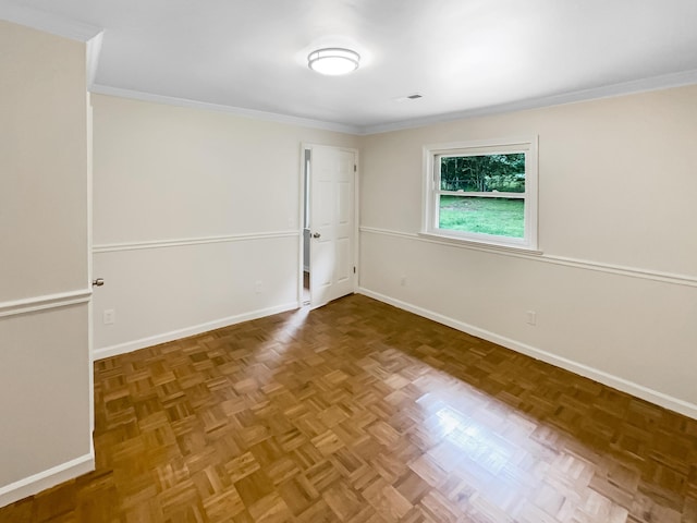 unfurnished room featuring crown molding and baseboards
