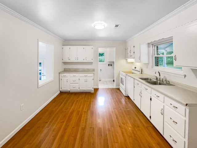 kitchen featuring white electric stove, crown molding, light countertops, white cabinetry, and a sink