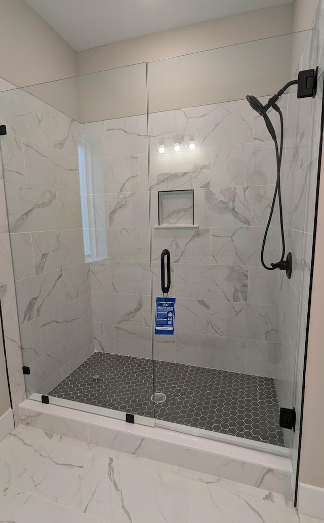 9162 Fuller Rd, Chattanooga, TN 37421 - bathroom featuring a shower stall and marble look tile flooring