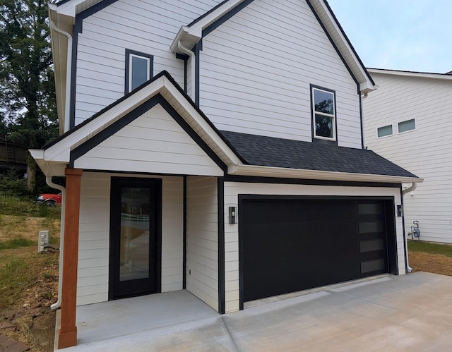 9162 Fuller Rd, Chattanooga, TN 37421 - view of front of property with an attached garage, concrete driveway, and a shingled roof