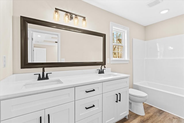 118 Earls Way, Chatsworth, GA 30705 - bathroom with toilet, wood finished floors, double vanity, and tub / shower combination