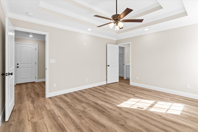118 Earls Way, Chatsworth, GA 30705 - unfurnished room with a tray ceiling, crown molding, ceiling fan, light wood-style floors, and baseboards