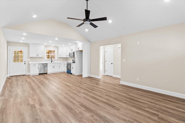 118 Earls Way, Chatsworth, GA 30705 - unfurnished living room with a sink, lofted ceiling, baseboards, light wood-style flooring, and a ceiling fan
