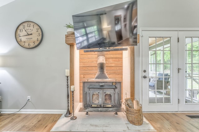 4950 Standifer Rd, Cohutta, GA 30710 - living area featuring a wood stove, wood finished floors, and baseboards