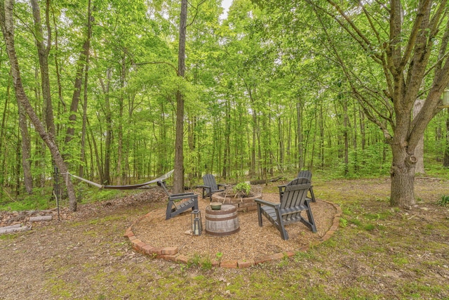 4950 Standifer Rd, Cohutta, GA 30710 - view of yard featuring an outdoor fire pit and a forest view