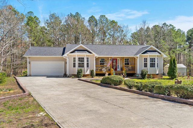 single story home with an attached garage, covered porch, and driveway