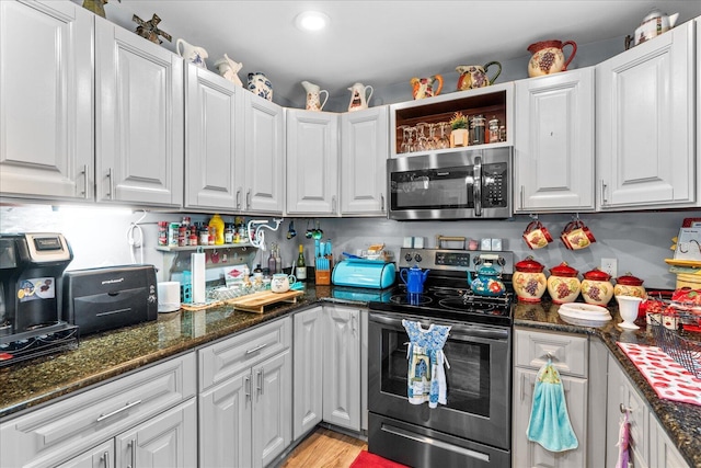 132 Katie Ln, Chatsworth, GA 30705 - kitchen featuring stainless steel appliances, white cabinetry, dark stone countertops, open shelves, and recessed lighting