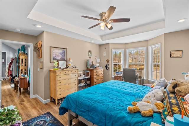 132 Katie Ln, Chatsworth, GA 30705 - bedroom featuring a raised ceiling, light wood finished floors, recessed lighting, and a ceiling fan