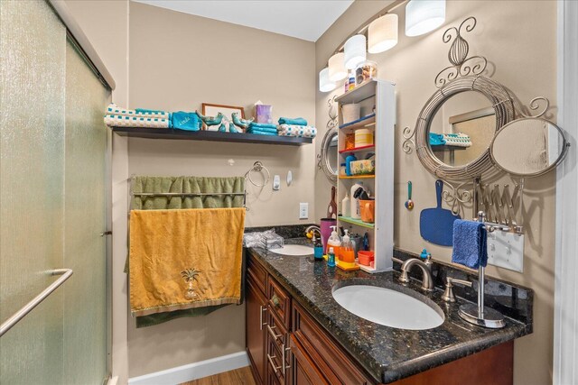 132 Katie Ln, Chatsworth, GA 30705 - full bath featuring a shower stall, double vanity, and wood finished floors