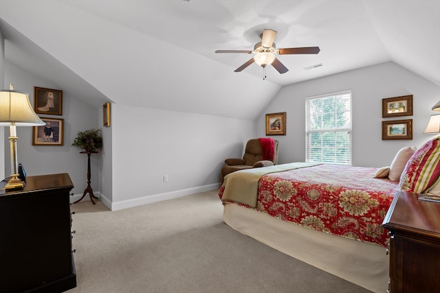 bedroom featuring carpet, vaulted ceiling, a ceiling fan, and baseboards