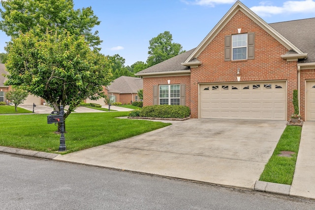 traditional home with brick siding, driveway, a front yard, an attached garage, and roof with shingles