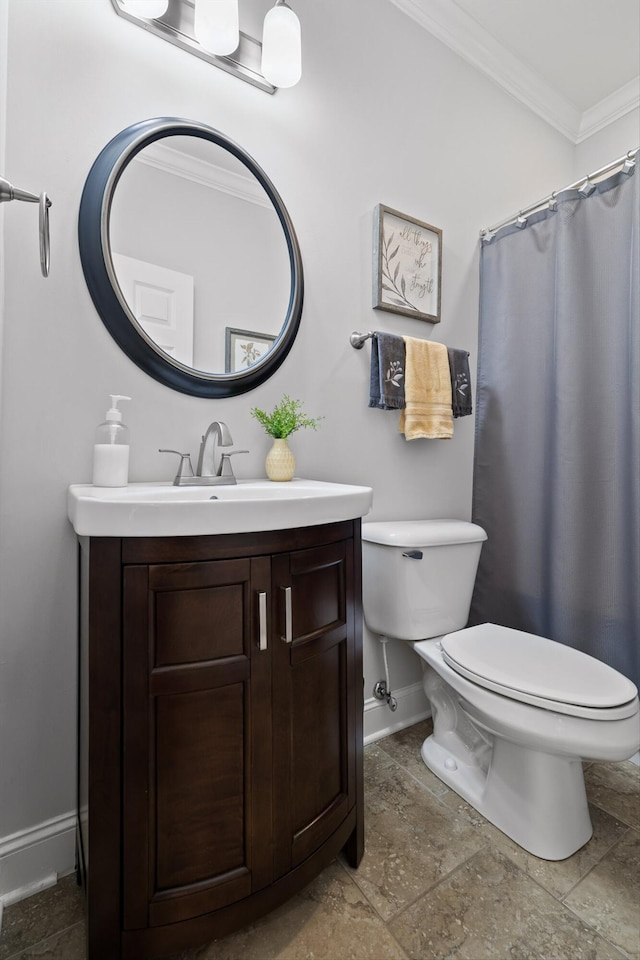full bathroom featuring baseboards, crown molding, toilet, vanity, and stone tile floors