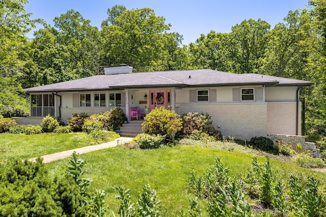 115 Golf Dr, Signal Mountain, TN 37377 - view of front of house with brick siding, a chimney, a front yard, and covered porch