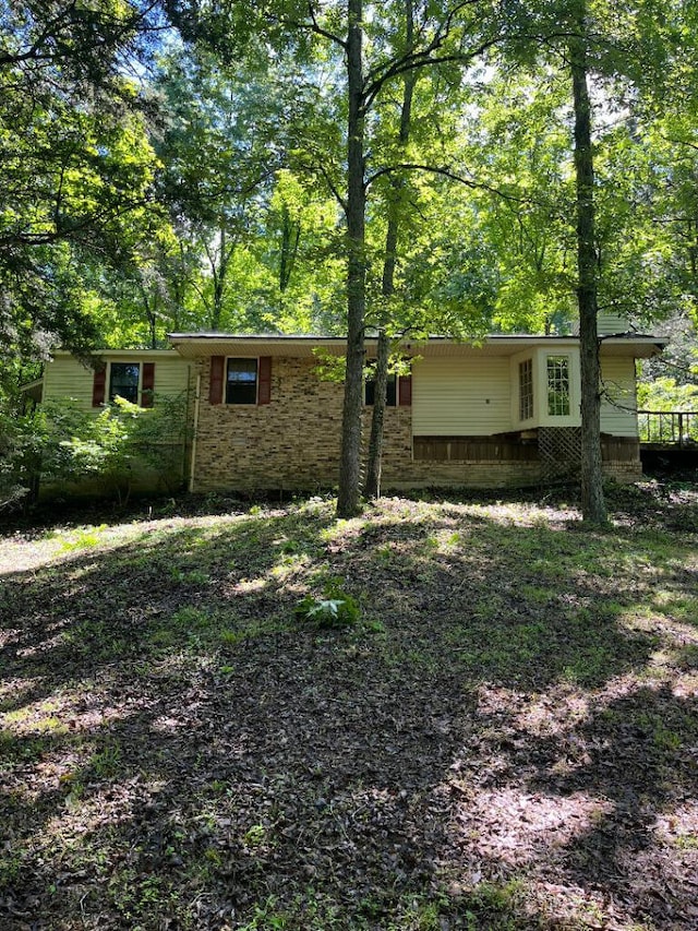 exterior space with brick siding